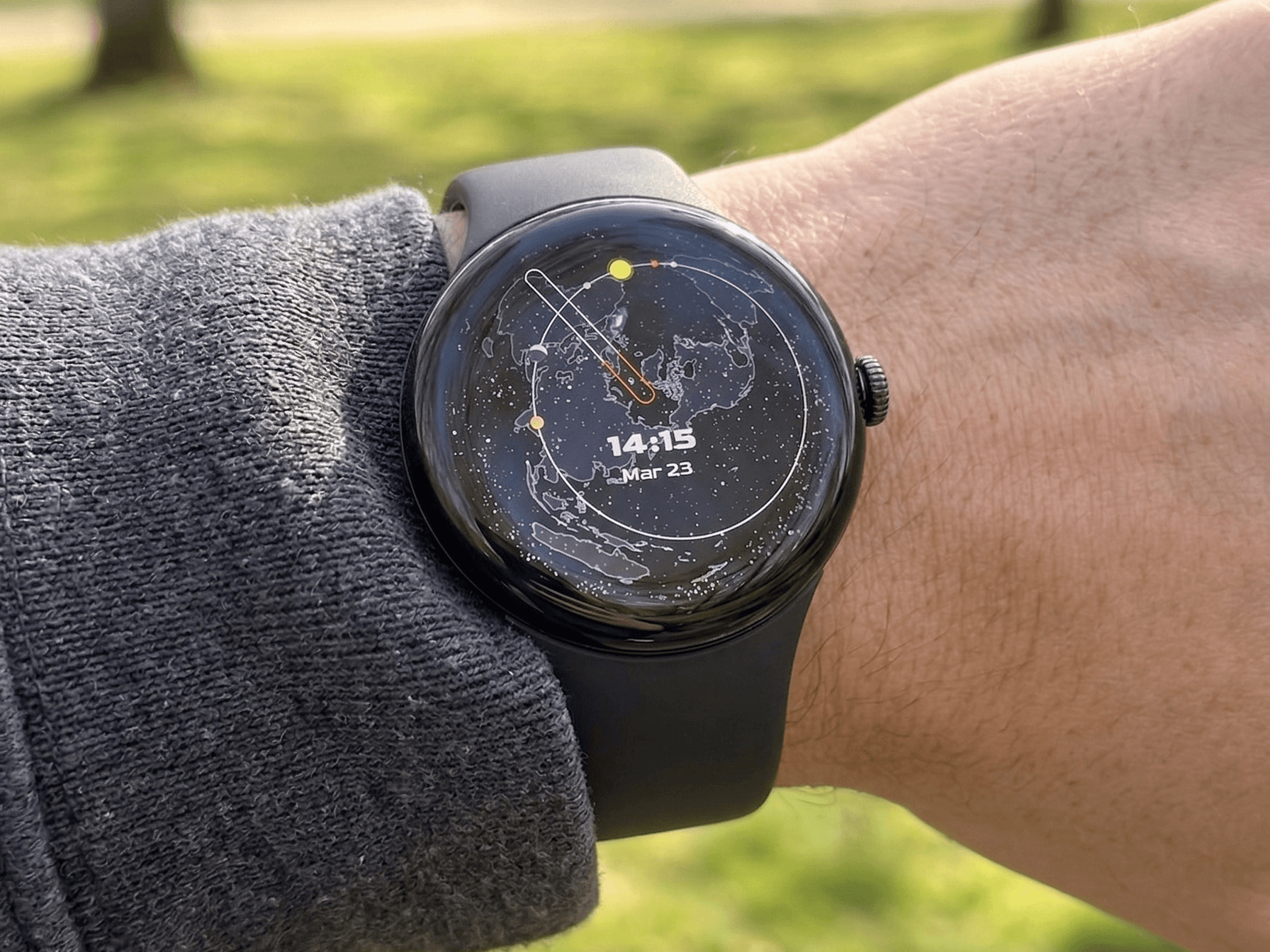 Heaven and Earth watch on wrist showing star map with planets
